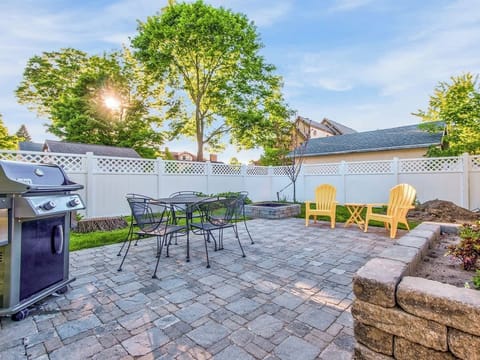 Fire Up the Grill on the Shaded Patio, Where Summer Meals Come Alive Under the Open Sky