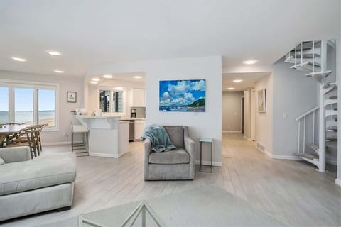 Living Room, Dining Room and Kitchen, all with Lake Views