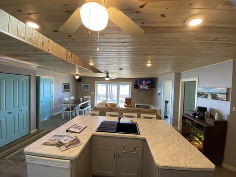Kitchen sink in island with views out to waterfront