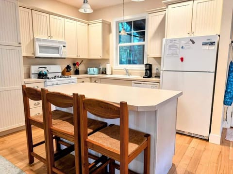 Three stools. One cook. Endless snack breaks. This is where everyone ends upwhether theyre helping or just hovering.