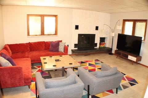 Living room with adjacent kitchen and dining