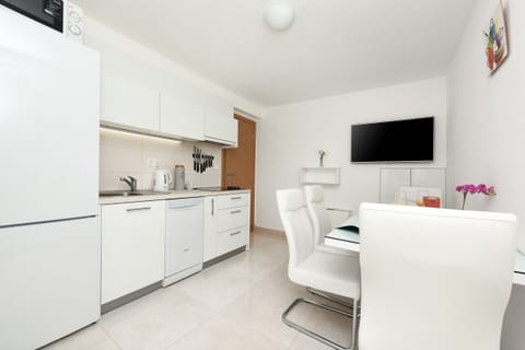 Kitchen, dining room, TV set