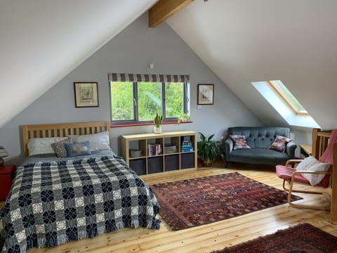 Comfy double Bed and sitting area in the Nest