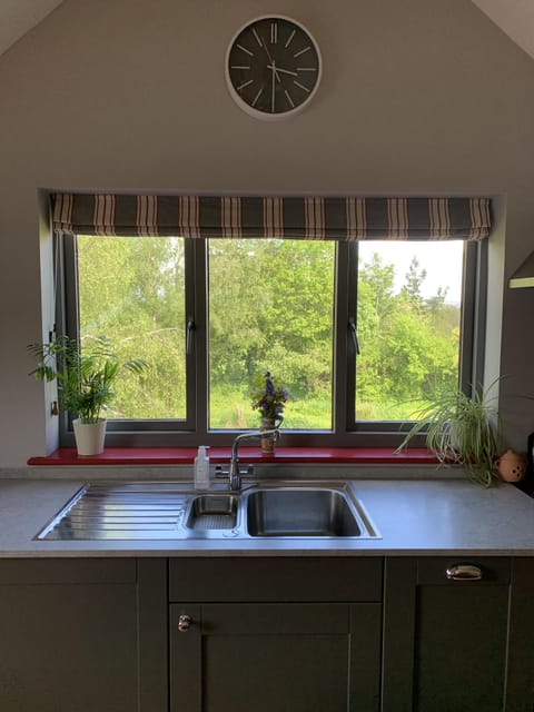 Kitchen window with countryside views over garden and ponds
