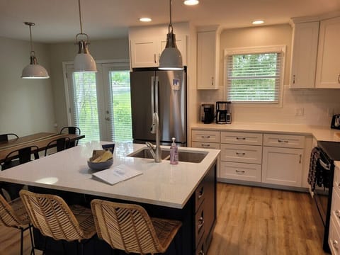 KITCHEN:  There is a full kitchen with all-new stainless steel appliances (including a dishwasher), a good supply of cooking and dining utensils, and lots of cupboard and counter space.