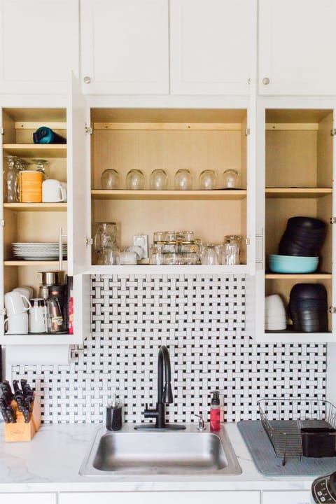 Fully Equipped Kitchen (Main Level): Large refrigerator with freezer, complete with mugs and glasses.