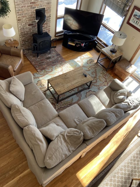 Bird's eye view of main living space from upstairs balcony.