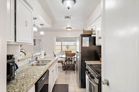 Kitchen: Whip up culinary delights in a spacious kitchen with sleek granite counters and natural light!