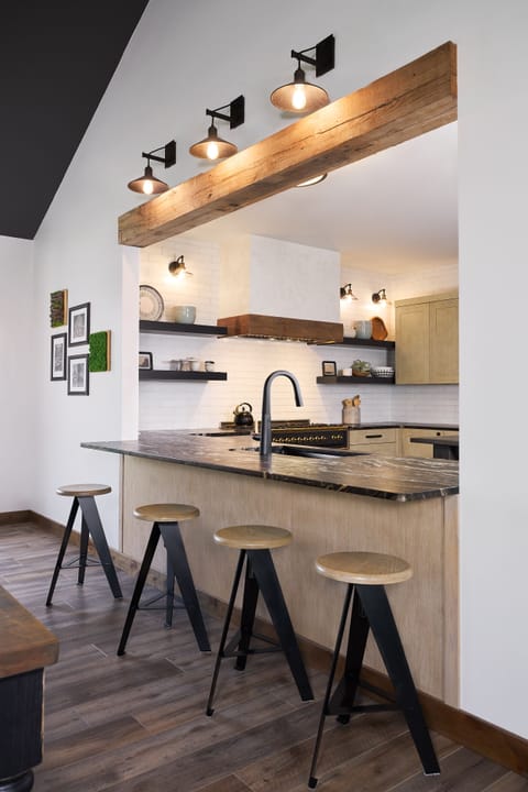 Cooks in the kitchen are connected to the action in the gathering room