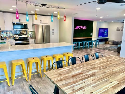 Extra-large dining table with additional bar seating for big groups