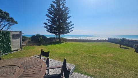 Large fenced beachfront lawn