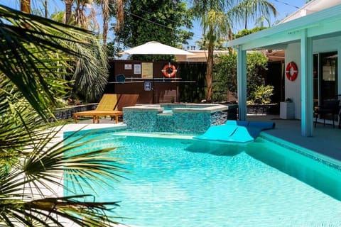 Backyard patio w/pool and hot tub.