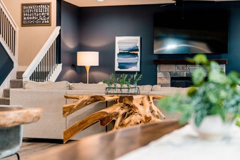 Beautiful interior details; variety of nautical/marine textures, materials, and hues.  Driftwood table, natural stone fireplaces, hardwood floors.. No detail is overlooked in this fine home.