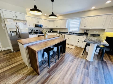 Spacious kitchen with eat in bar