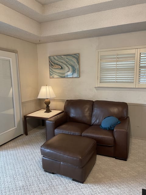 Leather love seat in living area