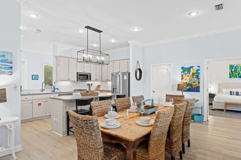 Your bright, open-concept living space blends coastal charm with modern convenience—perfect for cooking together and sharing memorable meals.