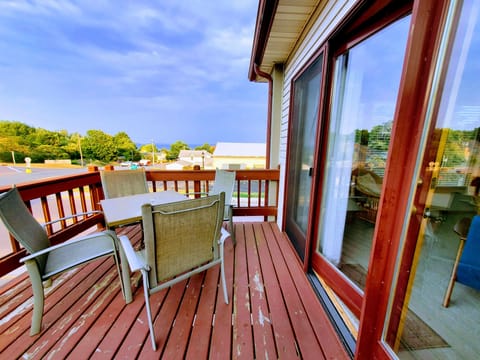 Unwind on the deck of this charming corner unit condo