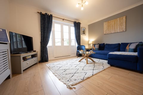 Modern and high end living area with views of our charming courtyard garden.