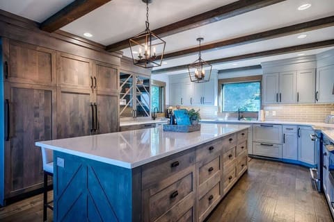 We have a spacious family kitchen that is adjoined to the dining area with comfortable bar stools. It's a great place to gather and enjoy a meal or a quick snack.