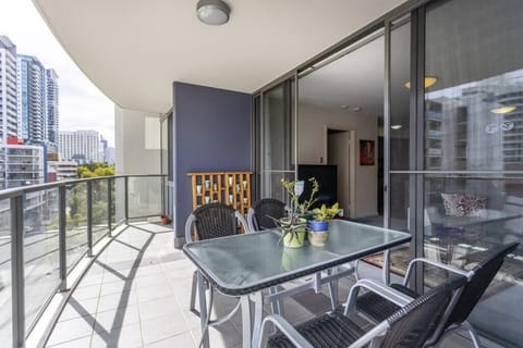 Step out onto the inviting balcony, furnished with an outdoor table and chairs, offering an extension of your living space for fresh air and relaxation.