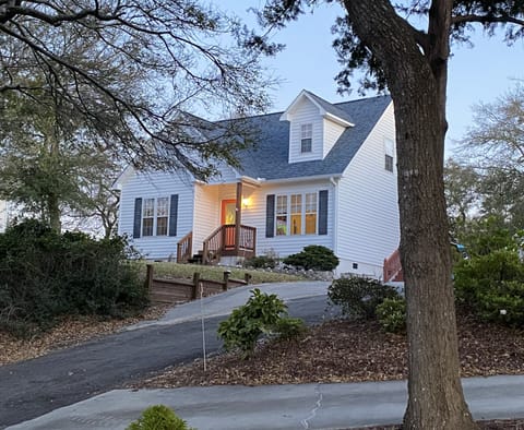 Home sits atop a driveway that offers ample parking and views of the Sound.