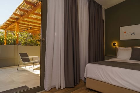Sleeping area and doorway to private terrace 