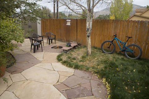 Backyard with smokeless fire pit and shed for all your outdoor gear!