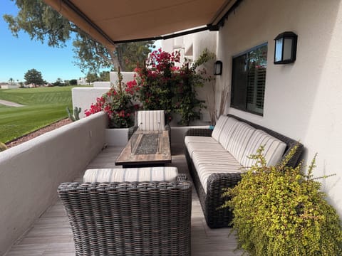 Outdoor living room with the glass, tabletop fire pit - overhang extended