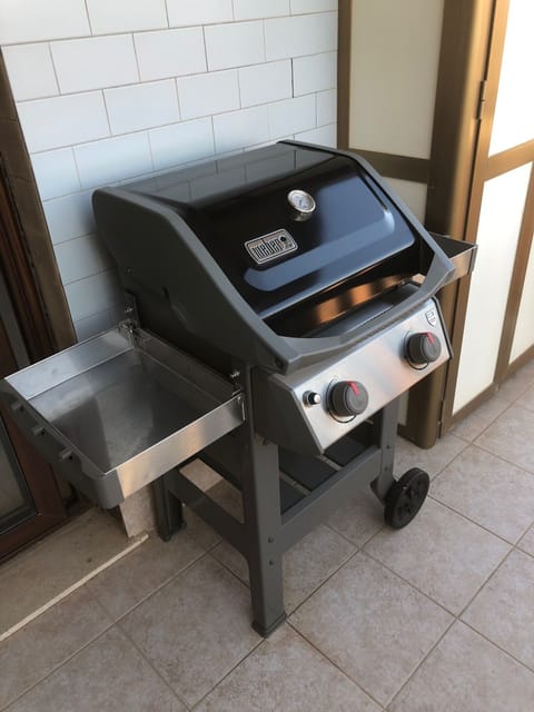 Weber gas grill for year-round cooking outdoors.