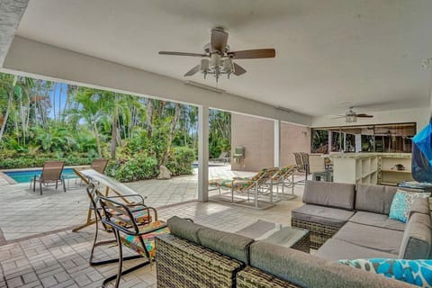 Relax poolside in your own private resort style oasis surrounded by lush palms
