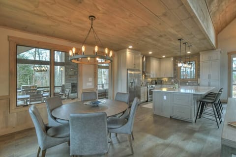 Main floor living room with open dining and kitchen area