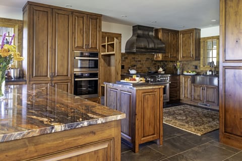 Open kitchen that looks into dining area and main living room