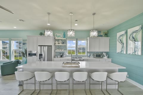 Kitchen island provides multiple seating.