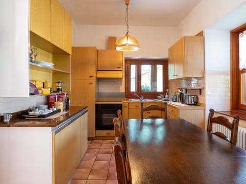 Cabinetry, Furniture, Countertop, Table, Window, Wood, Kitchen, Chair, Kitchen Appliance, Orange