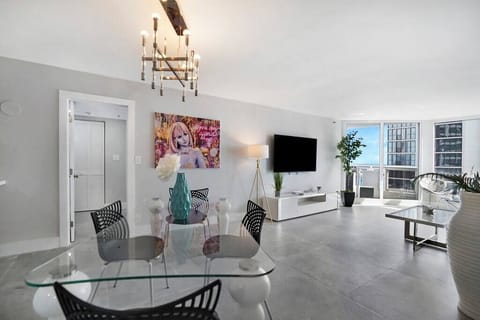 Dining/living area, Roku tv, balcony access, view into master bedroom