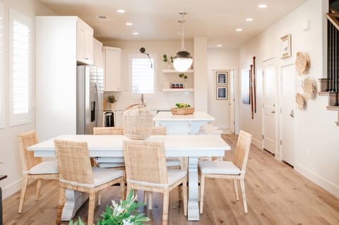 Spacious dining area with natural light and seating for shared meals.