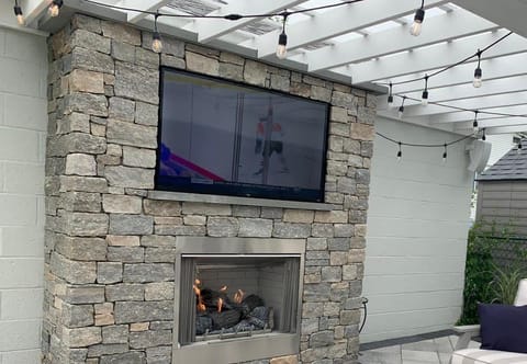 outdoor fire pit and tv off side yard