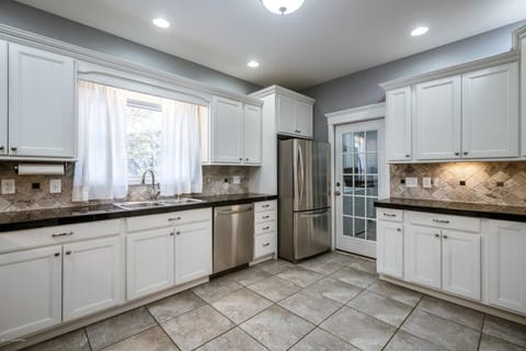 Natural light fills the kitchen space which leads to the backyard.