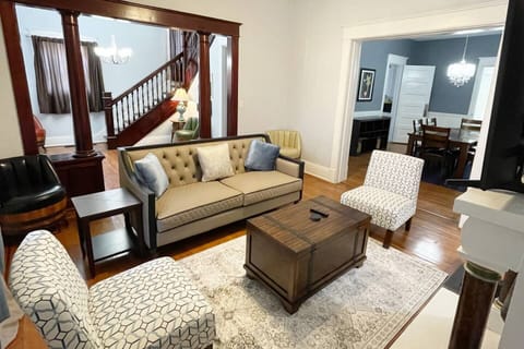 Formal living room open to dining area. Plenty of space to gather and watch the 75" 4KTV