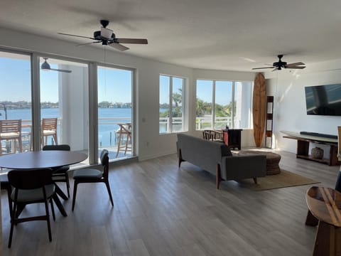 Enjoy spectacular views of Dona Bay in this open and airy living/dining area