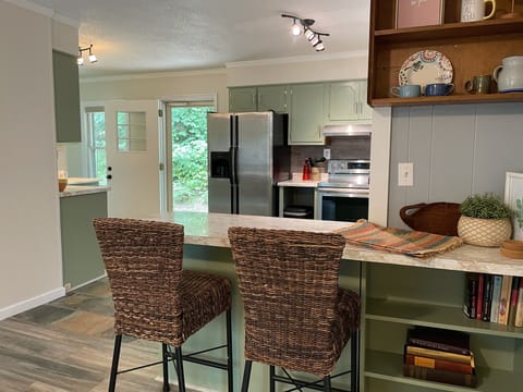 Extra seating is available at the kitchen peninsula.