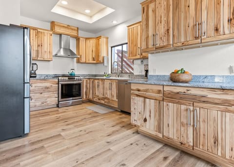 Upscale kitchen with custom hickory cabinetry 