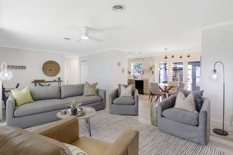 Sunny living room with large Roku TV, perfect area to relax. 
