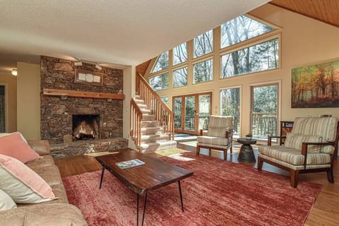 Living room with queen size sleeper sofa and wood burning fireplace