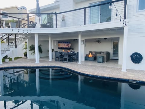 65 inch TV rotates and pulls out for viewing sports/movies from the pool