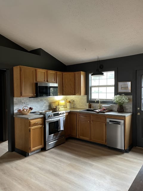 Full Kitchen : With coffee pots, pots/pans, and dinnerware 