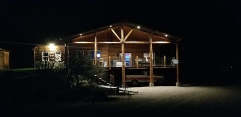 View of cabin at night.