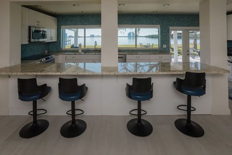 View of river and backyard from bar area & kitchen