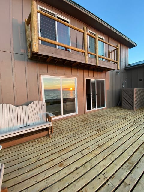 Outdoor hot/cold shower after the beach.  Sun reflection in glass is free!