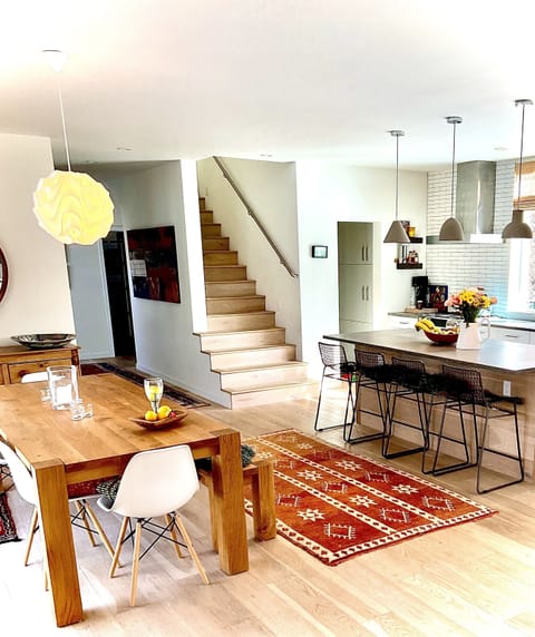 Farmhouse table and Island dining in newly built home in historic Basalt, CO.